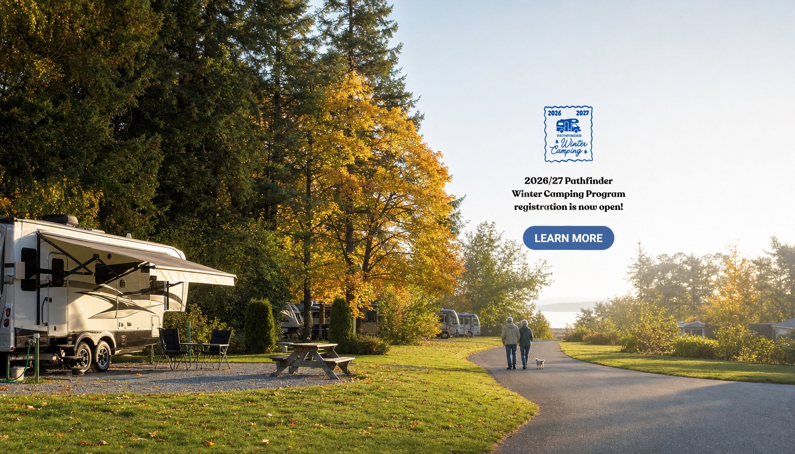 Sunny autumn morning at a Pathfinder RV site, a couple walking their dog past golden maples, on the banner for the 2026/27 Pathfinder Winter Camping Program, registration now open