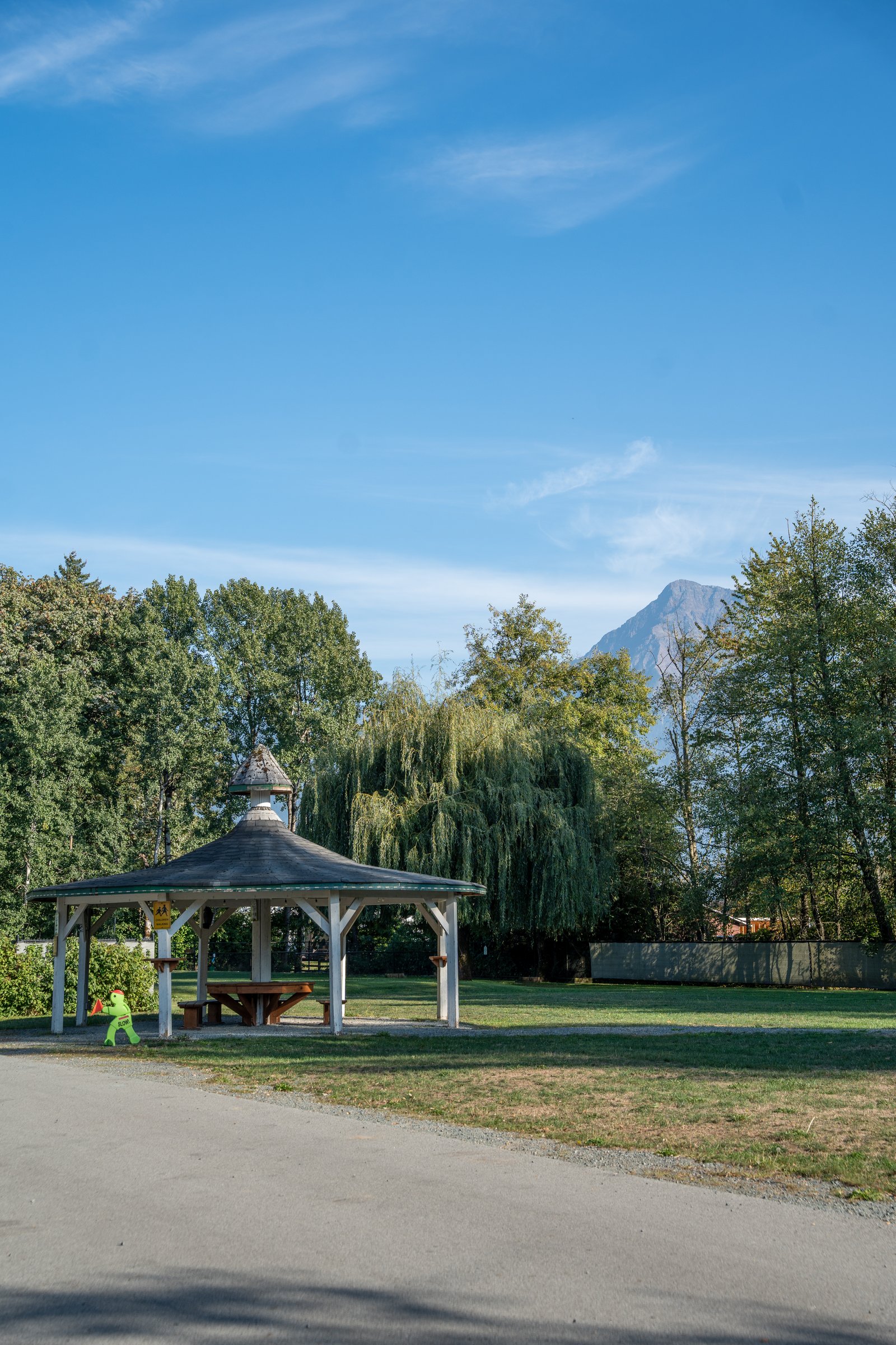 Gazebo on the green with a mountain peak behind at Pathfinder Agassiz-Harrison